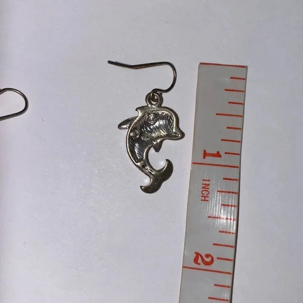 N/A dolphin earrings